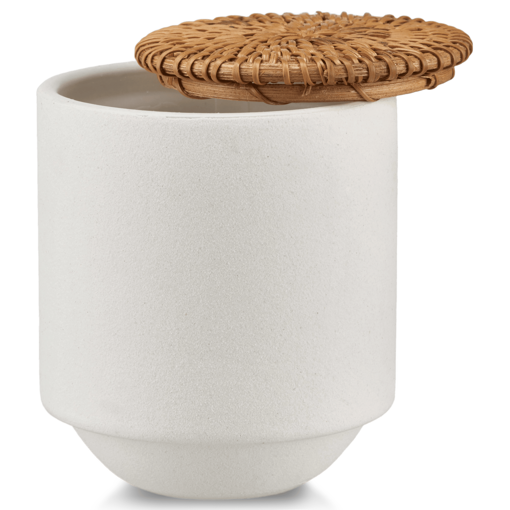 Chandelle dans un pot en céramique blanche avec couvercle en rotin